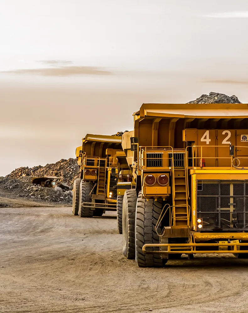 view of heavy construction vehicles in a mine